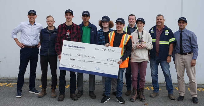 PMP donates $3,000 to local students robotics team image